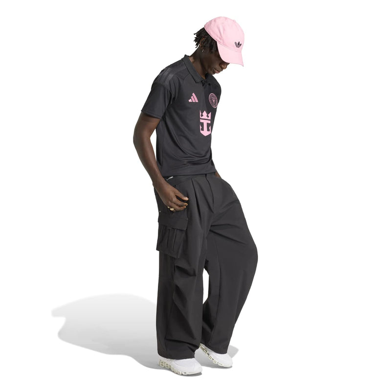 Men's black soccer jersey with pink Adidas logo and center graphic, side view