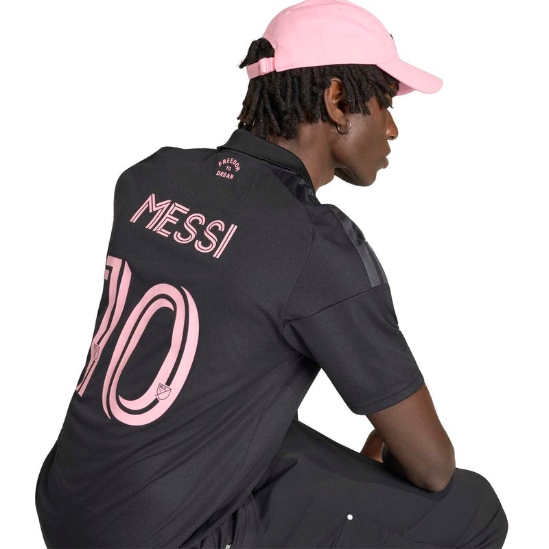 Men's black soccer jersey back detail with pink 'MESSI' and large '10' artwork