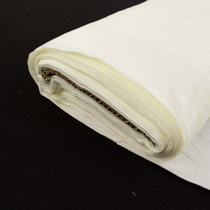Roll of cream-colored fabric with a smooth texture.