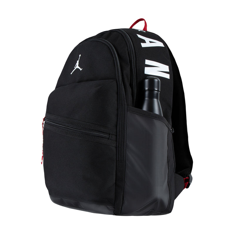 Black backpack with Jumpman logo, front zipper pocket, and bottle inside