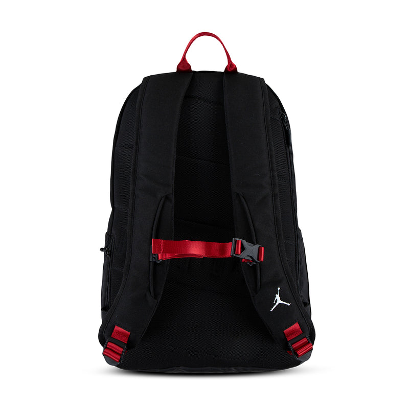 Black backpack back view with padded straps, red adjusters, and Jumpman logo