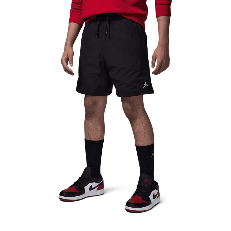 Youth black shorts with elastic waist, drawstring, and small side logo