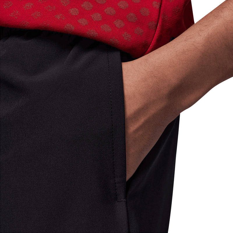Black youth shorts with visible side seam and stitched hem detail