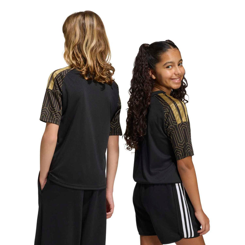 Youth black patterned soccer jersey, back view with gold shoulder trim