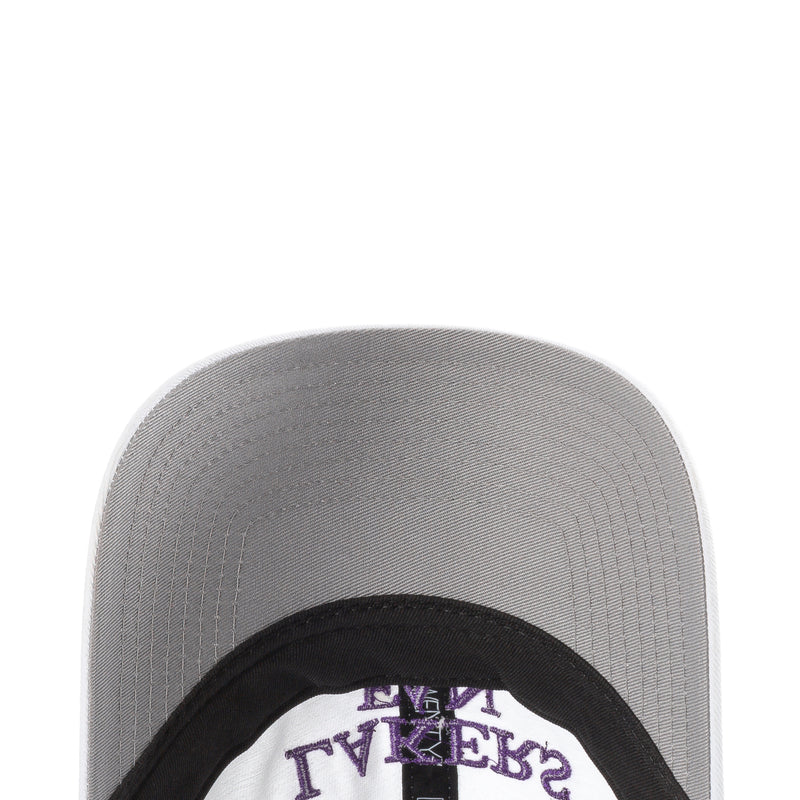 Gray cap underside with black inner band and purple lettering near brim