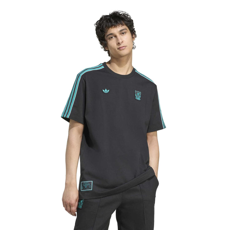 Men’s black Liverpool icon T-shirt on model, teal shoulder stripes and chest crests