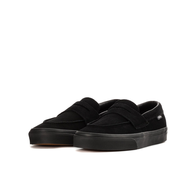 Youth black Vans slip-on loafer, side view, low platform sole