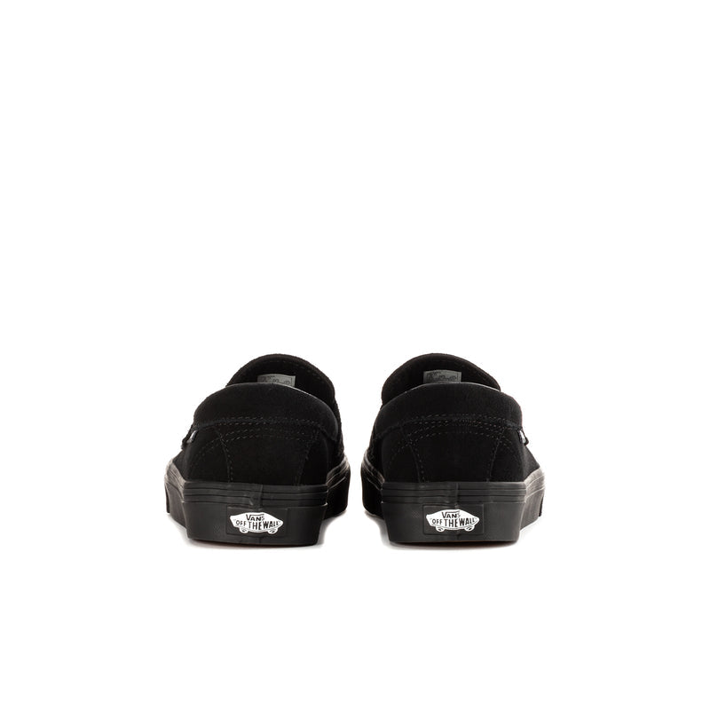 Youth black Vans loafer, heel view with branded patch and tread sole