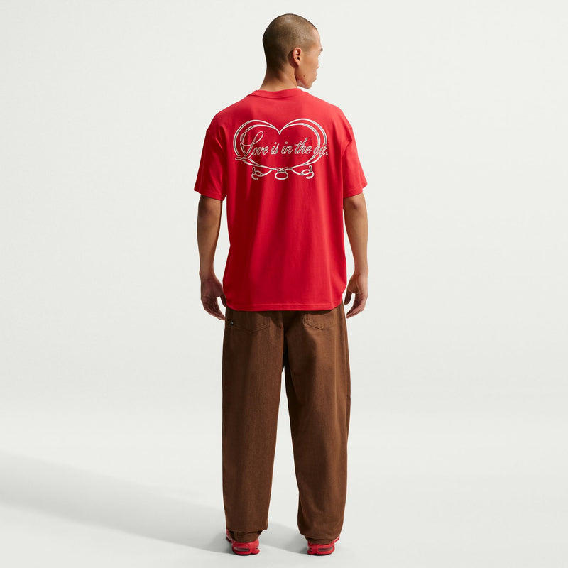 Men's red crew-neck T-shirt with heart back graphic and cursive text.