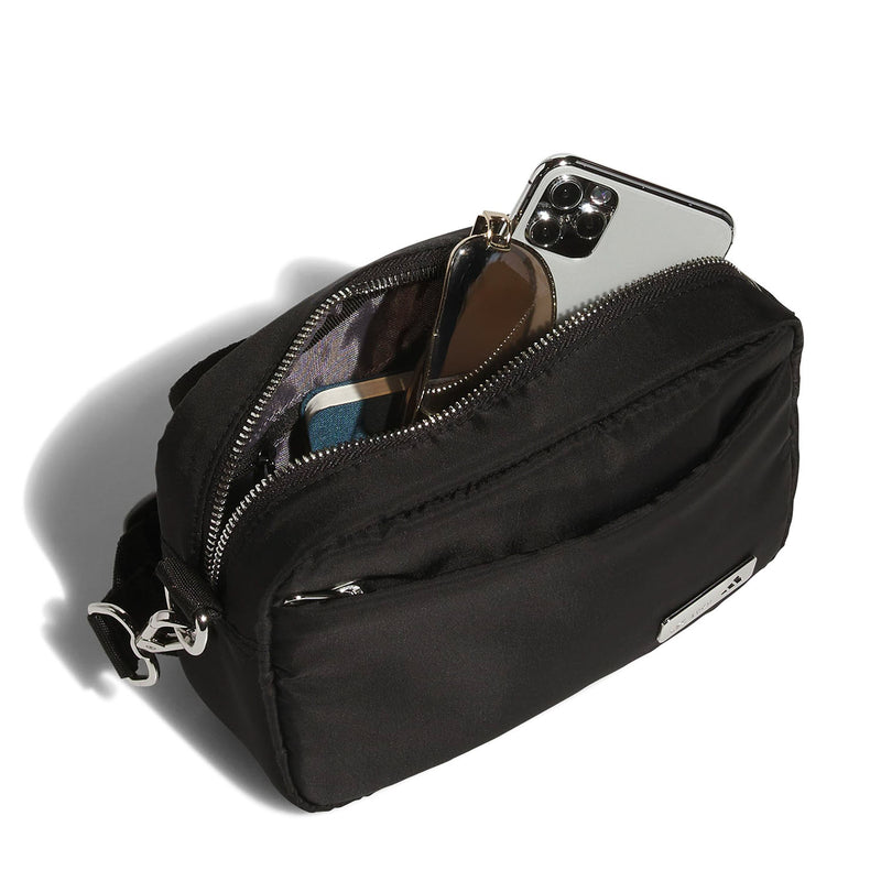 Black crossbody bag with open zip and visible phone in inner pocket