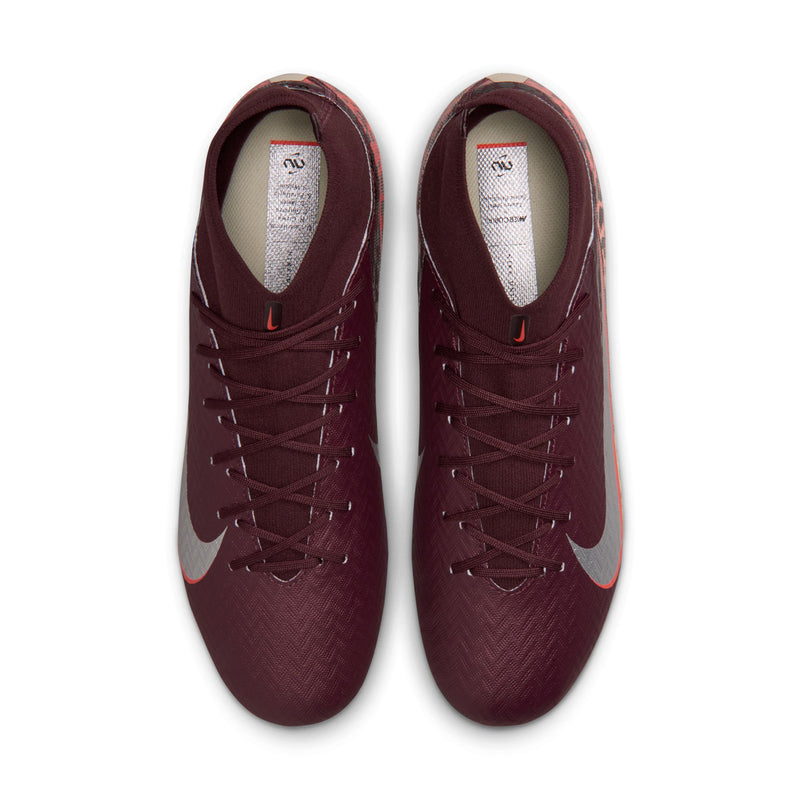 Pair of burgundy soccer cleats with lace-up front and Nike swoosh