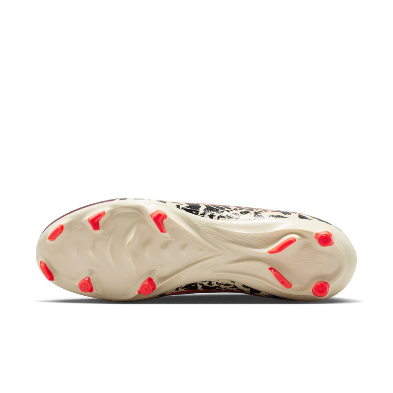 Burgundy soccer cleats showing white outsole with red studs for FG/MG