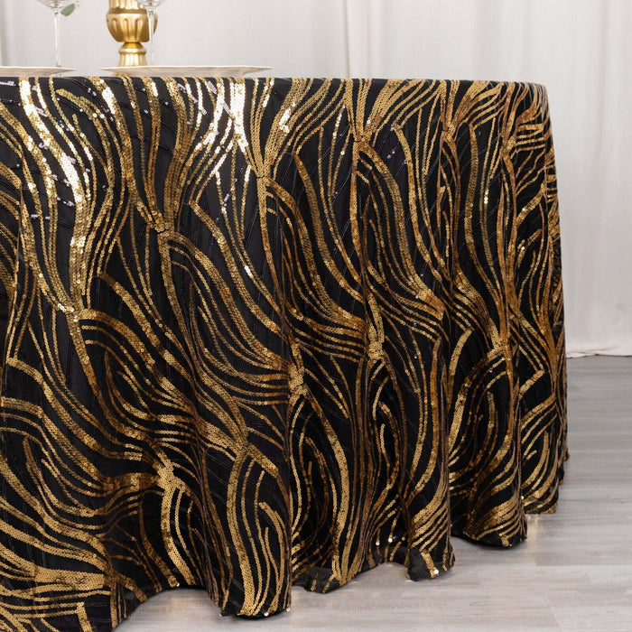 Gold and black sequined tablecloth with wavy design on a round table.