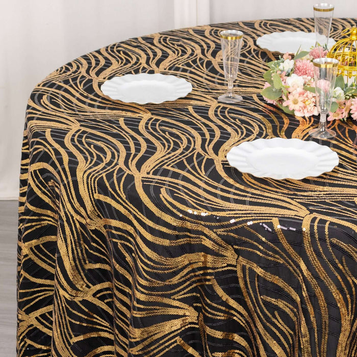 Gold and black wave-patterned tablecloth on a round table.