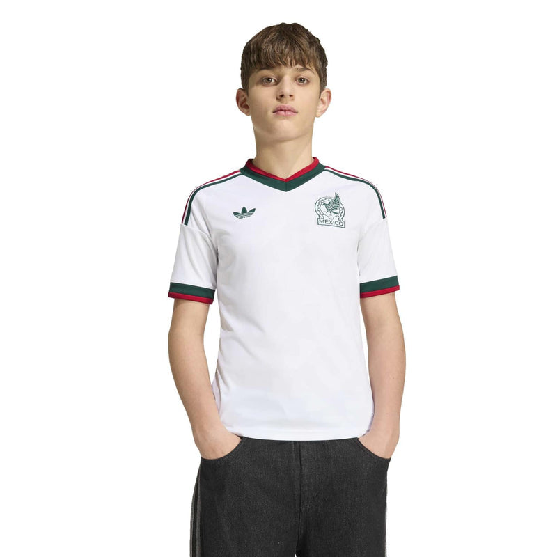 Youth white Mexico away jersey with green-and-red collar trim and small chest crests