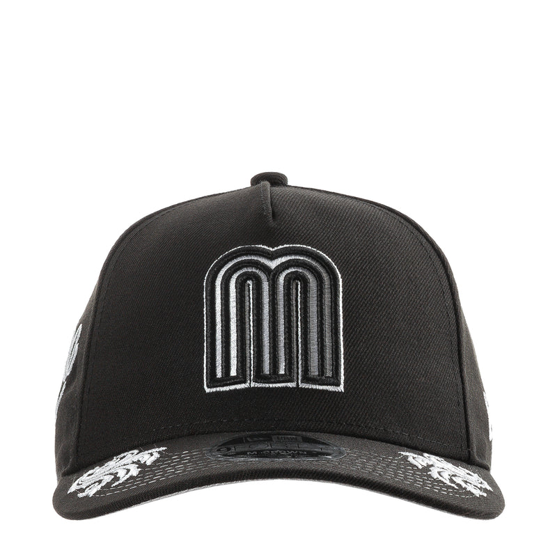 Black baseball cap with white monogram M crown logo patch on front