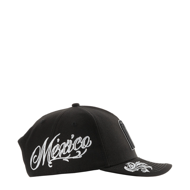 Black baseball cap with white 'Mexico' script wordmark on front