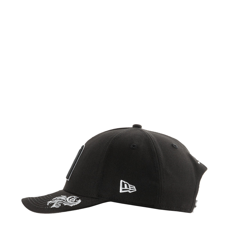 Black baseball cap with small white New Era flag logo on front