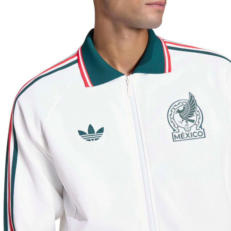 Men's white zip jacket close-up with Mexico crest and trefoil emblem