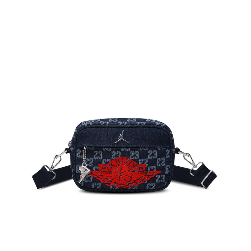 Dark indigo mini camera bag with red logo, zip top, crossbody straps