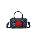 Dark indigo monogram mini duffle bag with red emblem, top handles, and side straps
