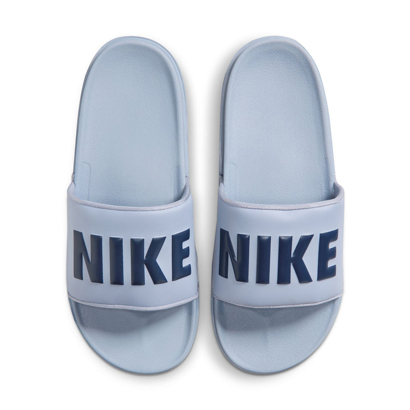 Pair of light blue slide sandals with wide NIKE band and cushioned footbed