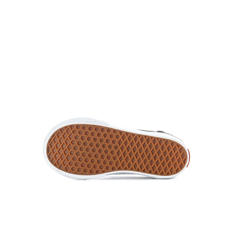 Kids Vans sneaker outsole with textured brown tread and white rubber edge