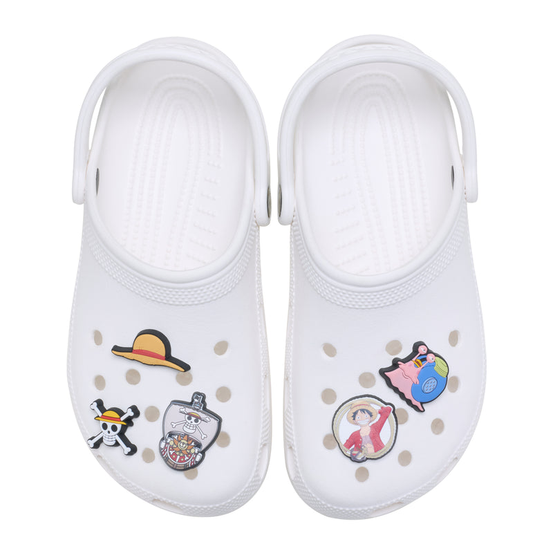 White Crocs-style shoe charms with cartoon character figures, multi-color, pair view