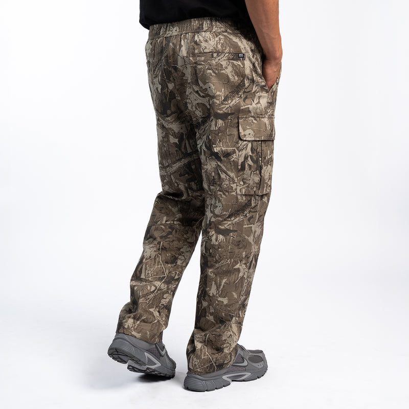 Tree camo cargo pants close-up of leg pockets and adjustable open hem
