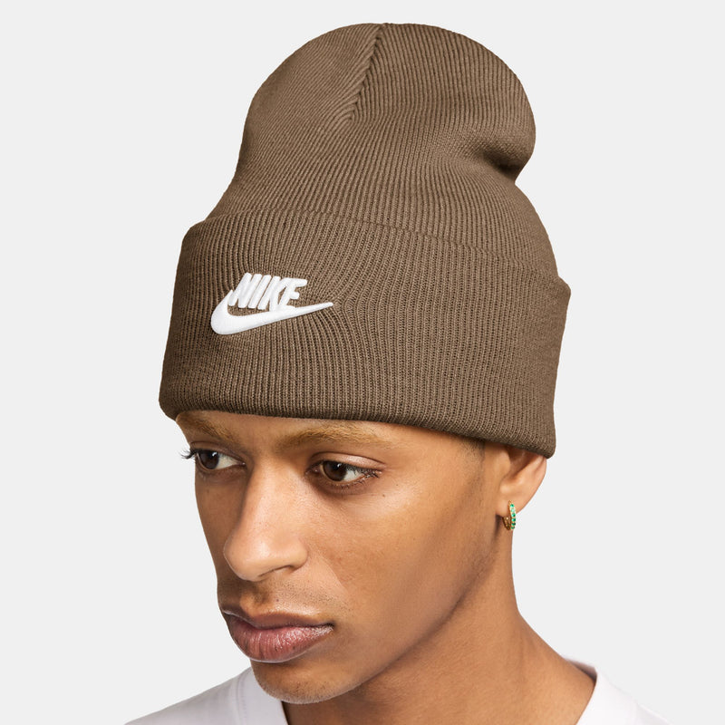 Brown ribbed beanie with folded cuff and white Nike swoosh logo on top