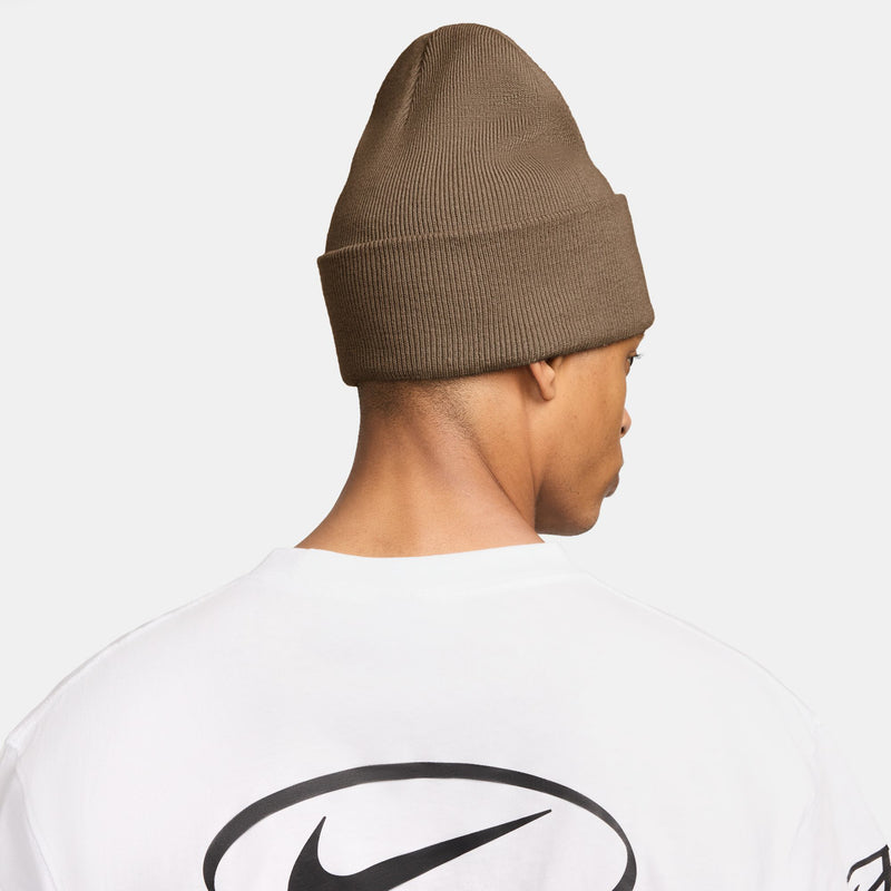 Brown knit beanie, back view with small Nike logo detail