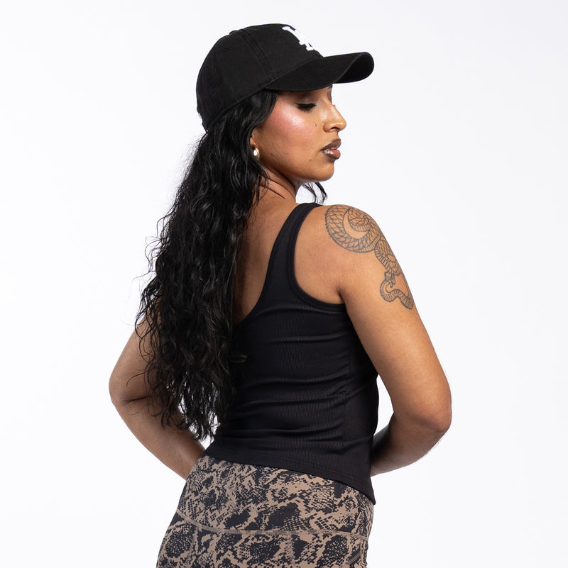 Womens black ribbed sport tank top from back view with racerback straps