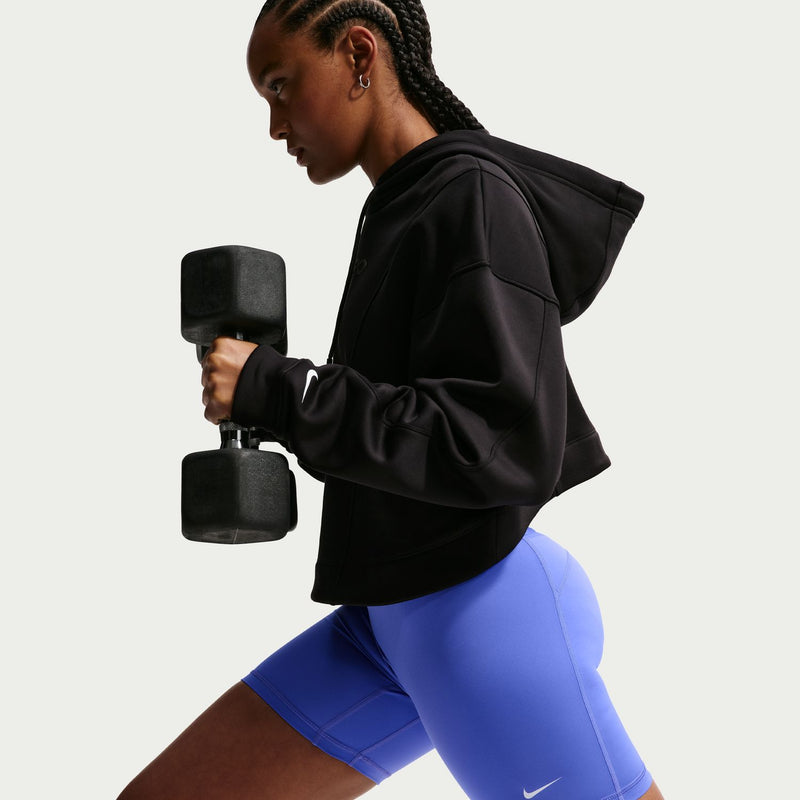 Women's blue 5-inch shorts on model, Nike Pro logo near hem