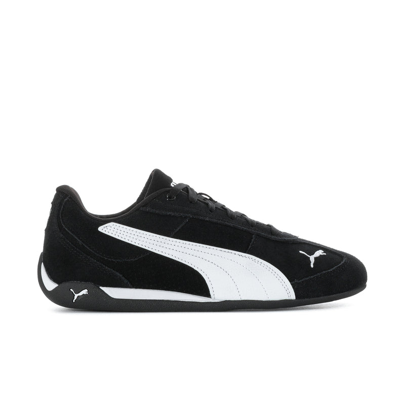 Men's black low-top sneakers with white PUMA stripe and lace-up front.
