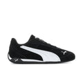 Men's black low-top sneakers with white PUMA stripe and lace-up front.