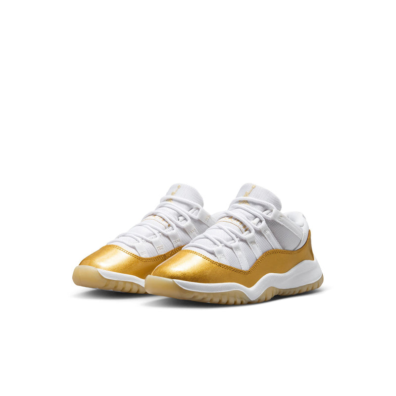 Kids low-top sneakers with white uppers, gold toe cap, and white laces