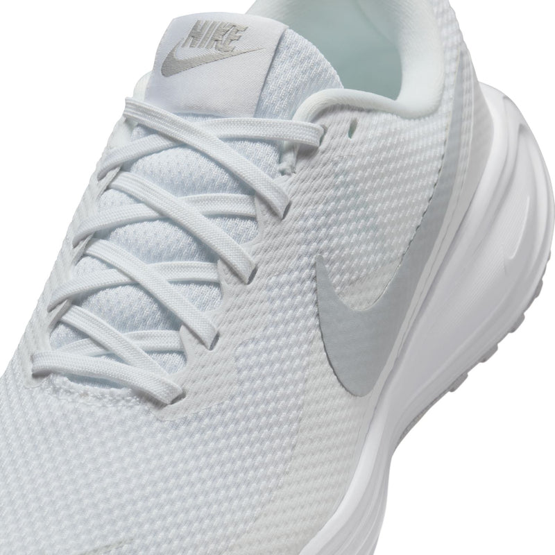 White lace-up knit upper shoe close-up with Nike swoosh and cushioned tongue