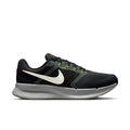 Men's black running shoes with white swoosh and neon green lace accents