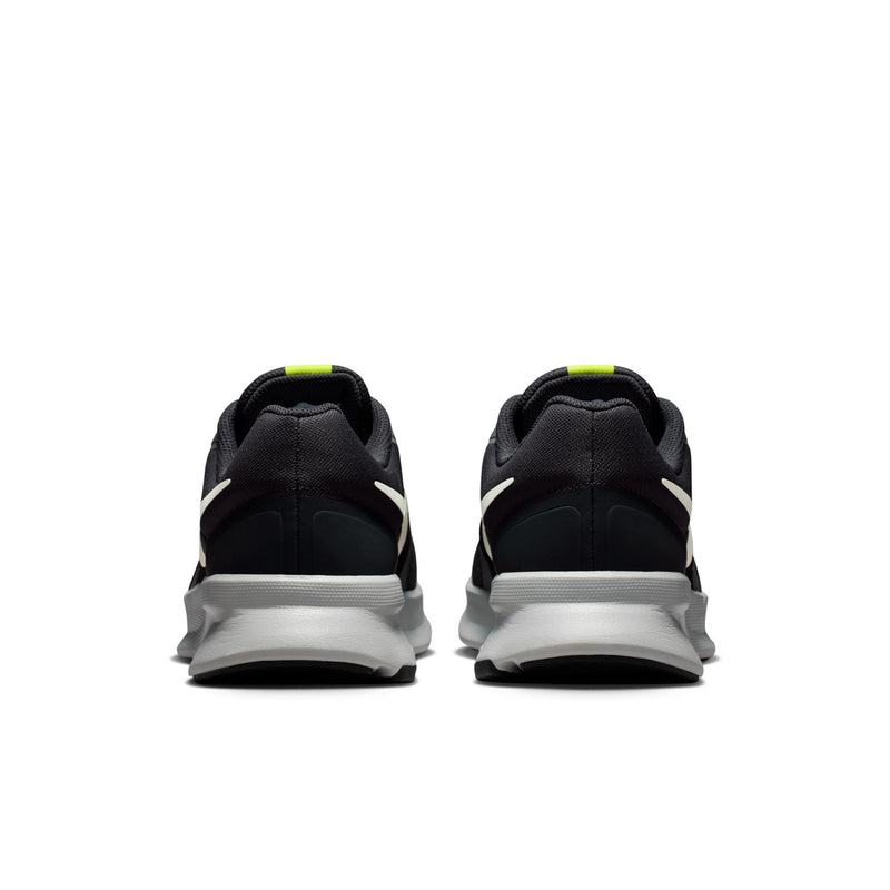 Men's black running shoes with white heel midsole and neon green details