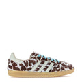 Low-top sneakers with leopard print, white stripes, blue laces, gum sole