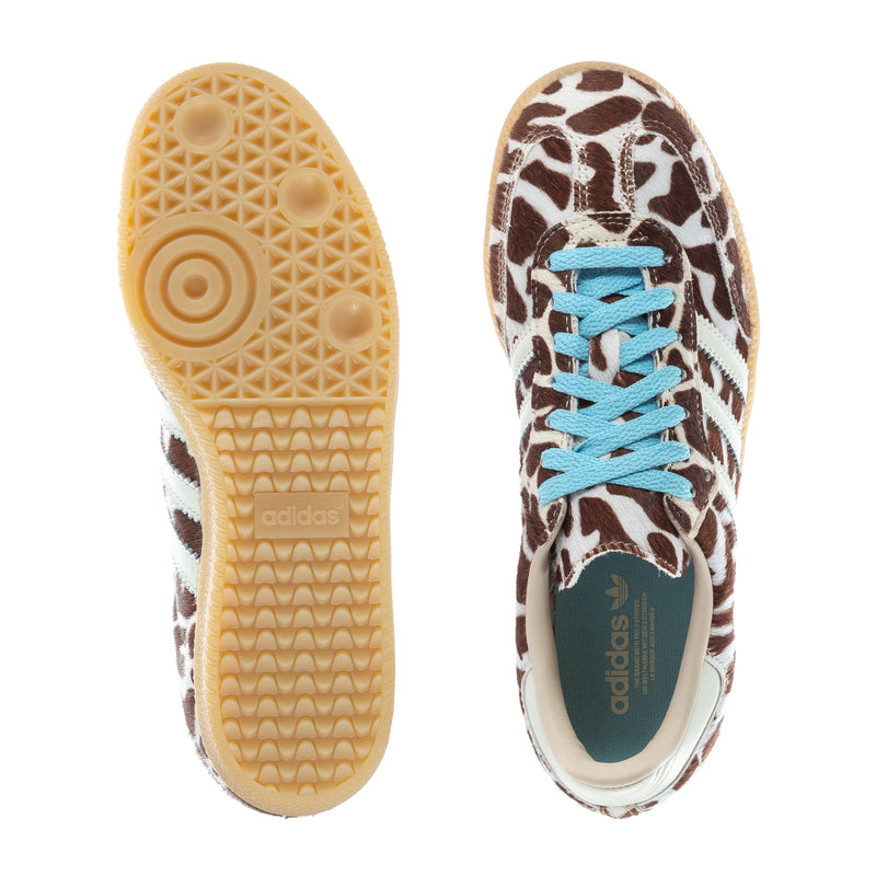 Sneakers outsole and side profile, leopard upper with blue laces and white stripes