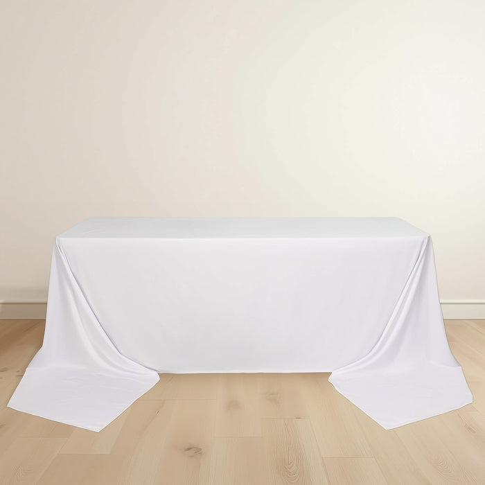 White tablecloth draped over a rectangular table.