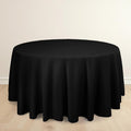 Round black tablecloth draped over a circular table.