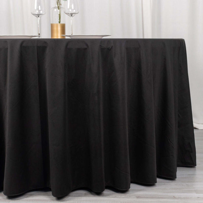 Black tablecloth draped elegantly over a table in a stylish setting.