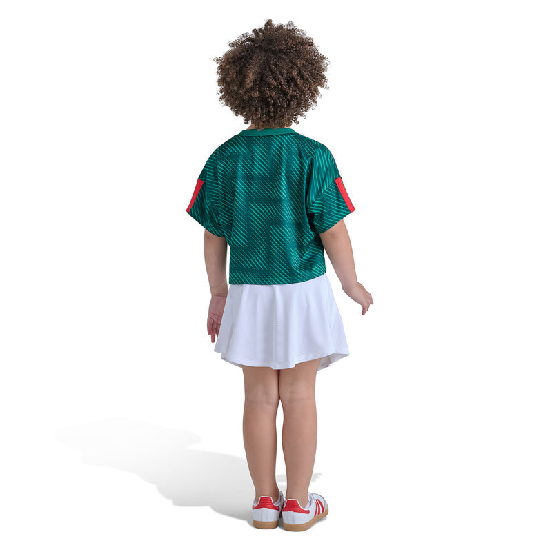 Kids green soccer skort set, back view: tee and white skort