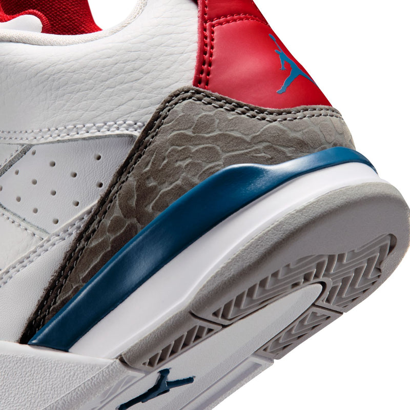 Kids sneaker close-up: gray textured panel, blue stripe, red inner lining, white tread