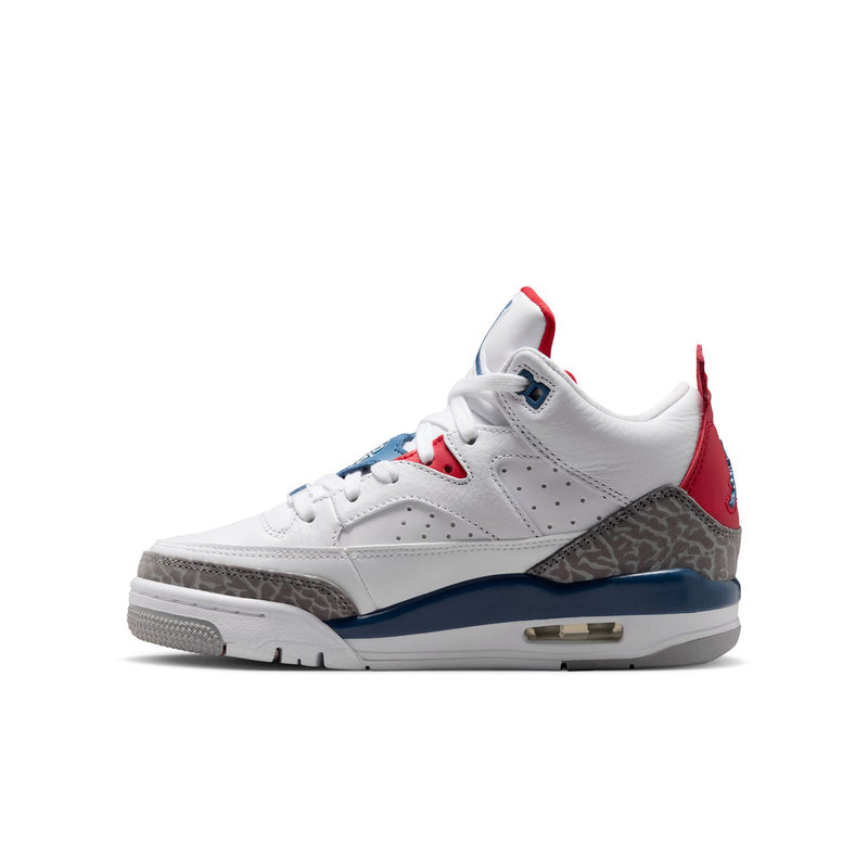 Youth low-top sneaker with white upper, red collar, and blue/gray side accent panel
