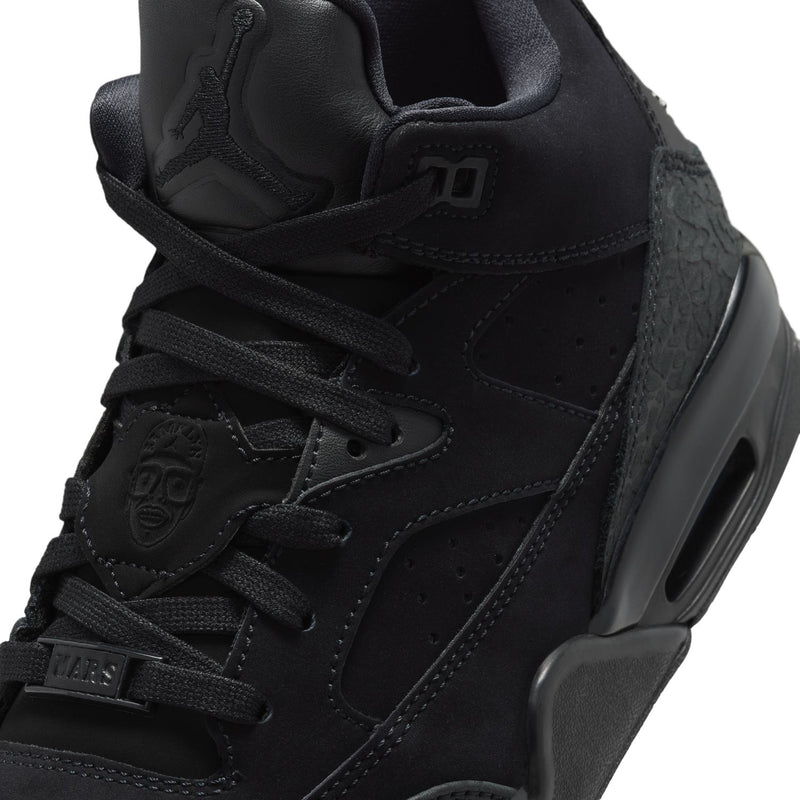 Black youth basketball shoes, close-up of laces, stitching, and logo accents