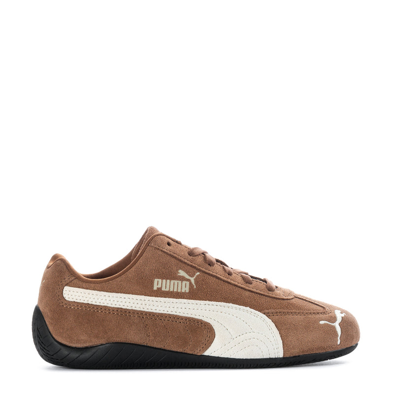 Brown suede low-top sneakers with PUMA logo and white side stripe