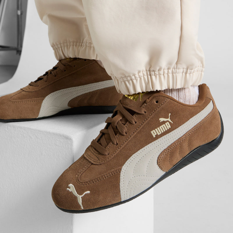 Brown suede sneaker, PUMA on tongue and heel, white midsole stripe
